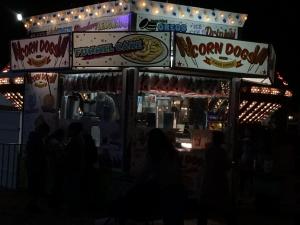 Corn Dog trailer at local fair at night 2017 with translucent vinyl on Marquee.